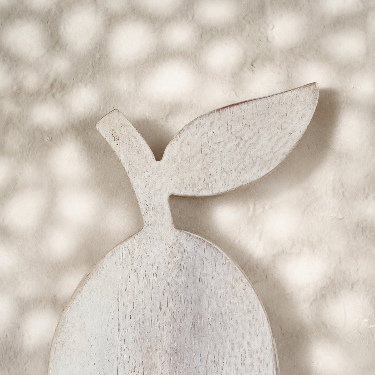 Close-up of the leaf detail on the whitewashed Orchard pear-shaped trivet
