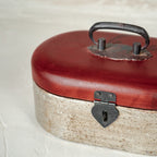 Warm-silver and red oval wooden jewellery box with zoom view