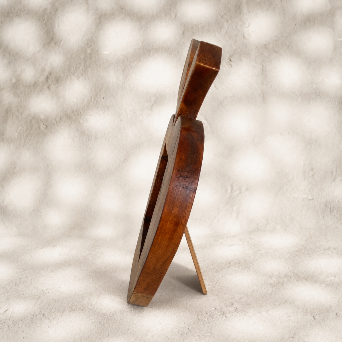 Side view of the Orchard apple-shaped wooden photo frame with easel stand