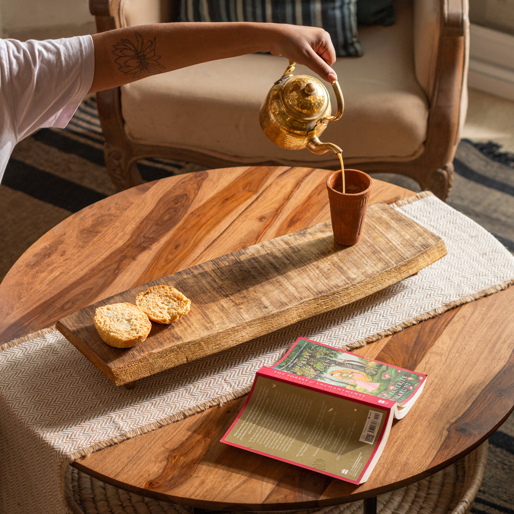 Bark wooden riser styled on a dining table