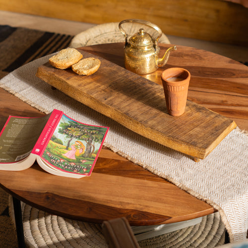Bark wooden riser styled with a bowl and snacks