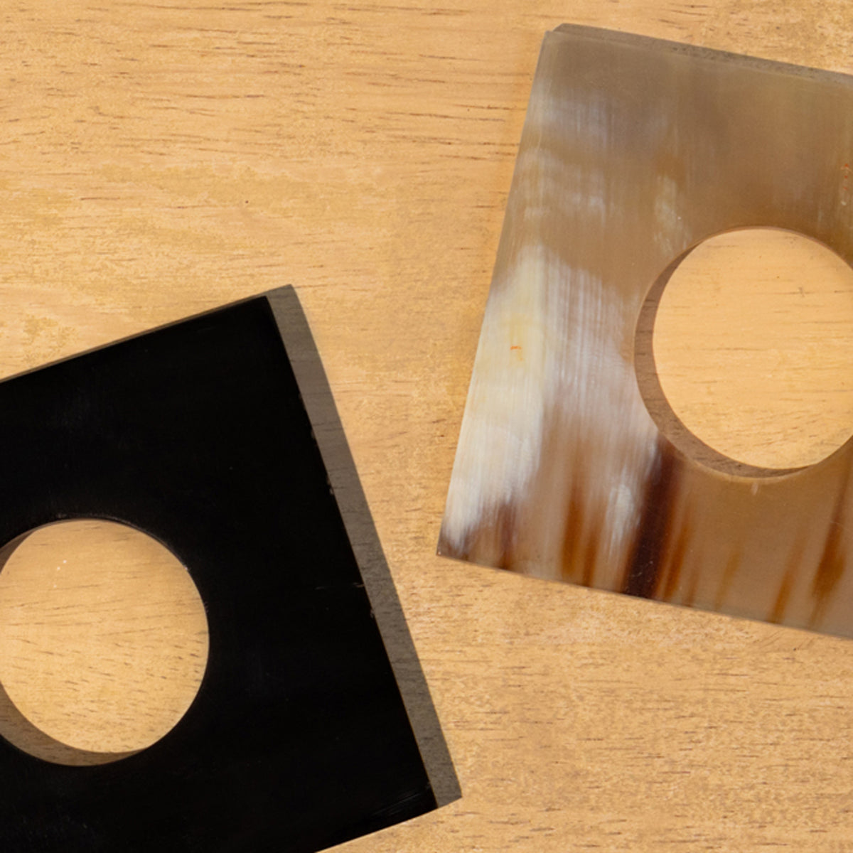 Close-up of black and translucent Block horn napkin rings