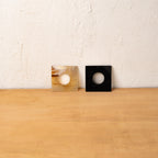 Black and translucent Block horn napkin rings displayed upright