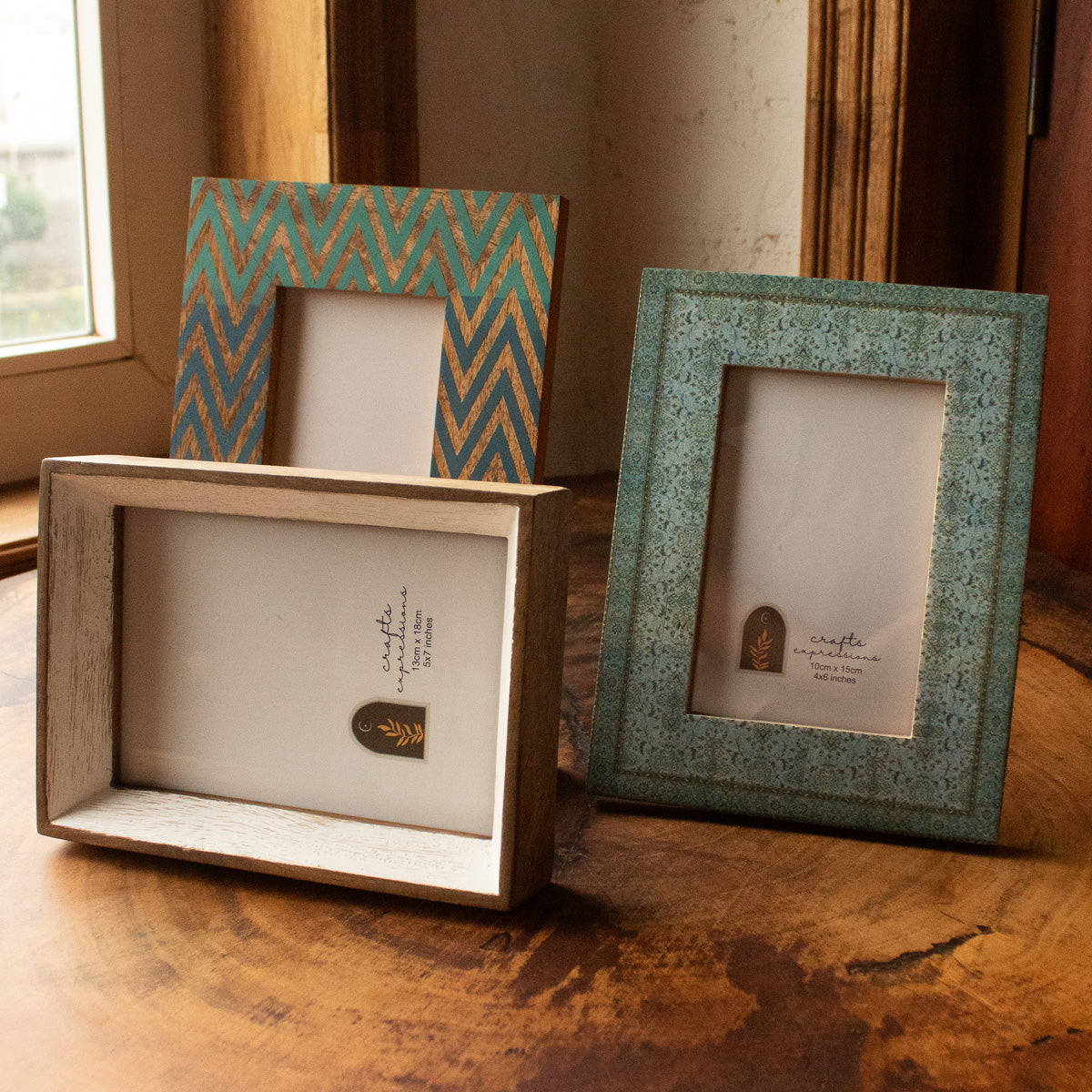 Blue Carpet wooden photo frame displayed vertically with other frames