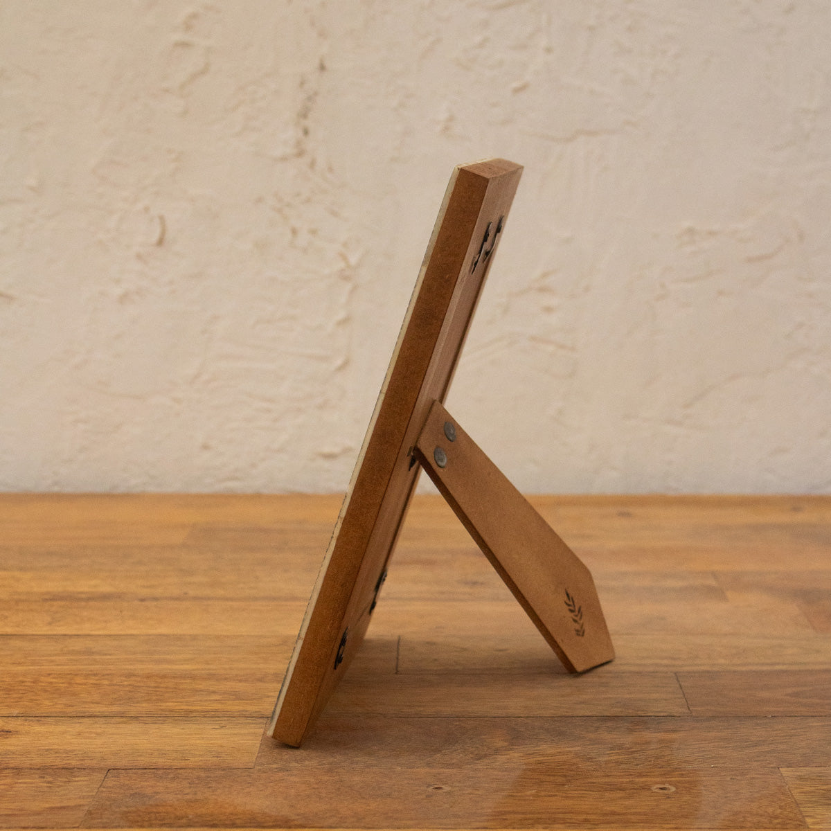 Side view of the Blue Carpet wooden photo frame with easel stand