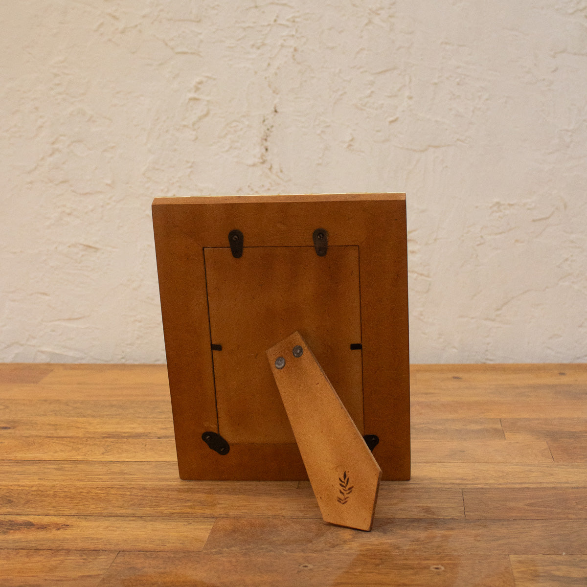 Back view of the Blue Carpet wooden photo frame with easel stand and wall fittings