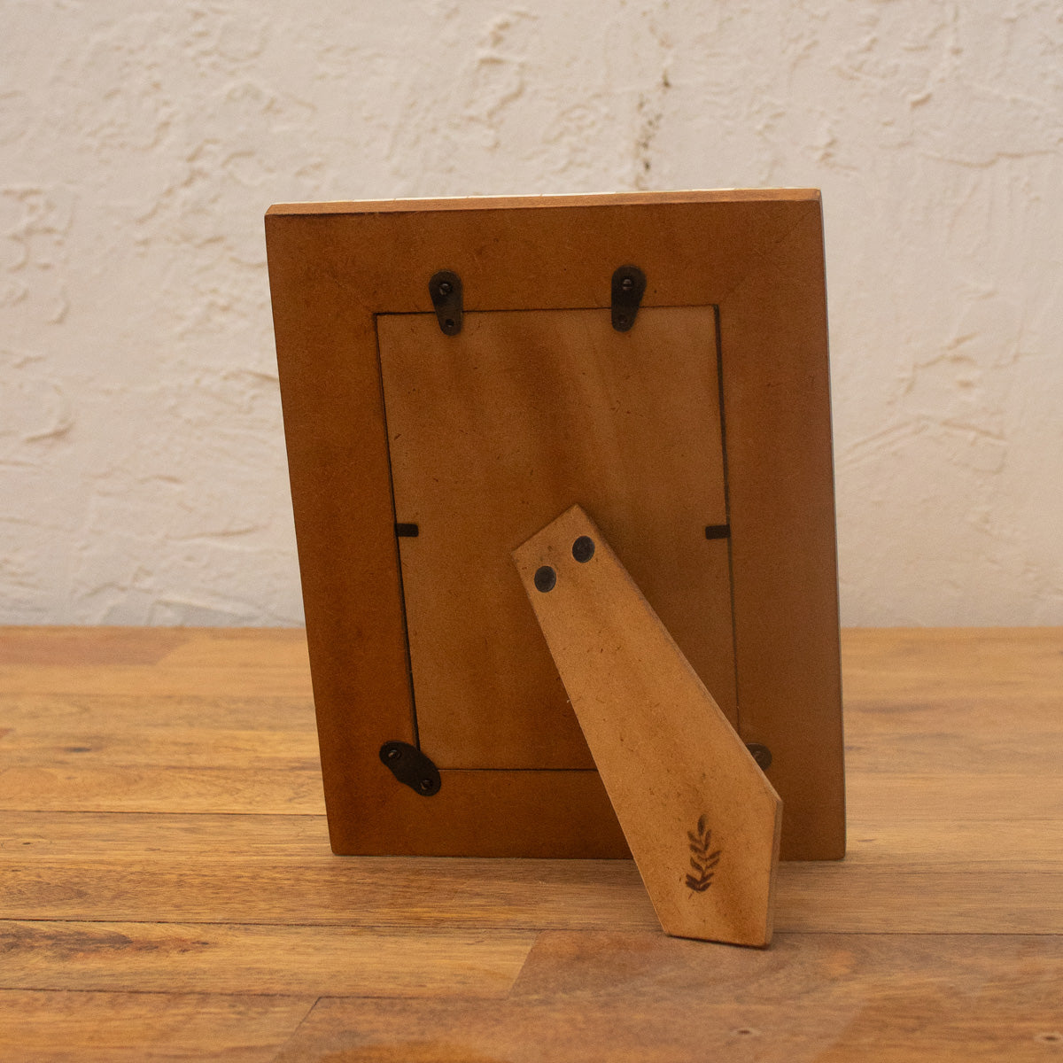 Back view of the Bohemian Jungle wooden photo frame with easel stand