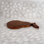 Low side view of the Orchard pear-shaped wooden trivet