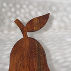 Close-up of the leaf detail on the Orchard pear-shaped wooden trivet