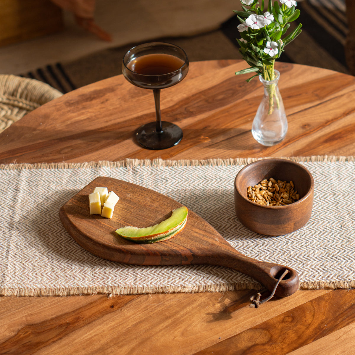 Celebration hamper serving board styled with snacks and a drink