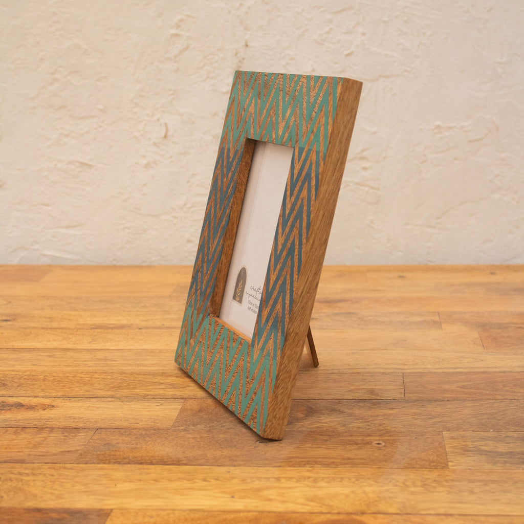 Angled view of the Chevron wooden photo frame displayed vertically