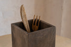 Close-up of a Cove wooden cutlery caddy holding utensils