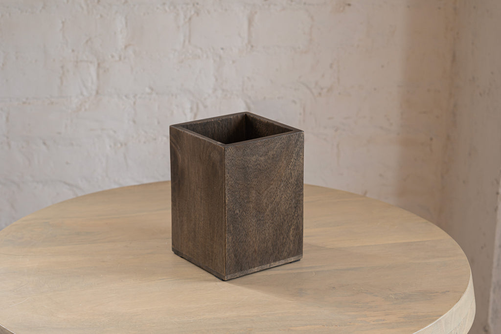 Front view of an empty Cove wooden cutlery caddy