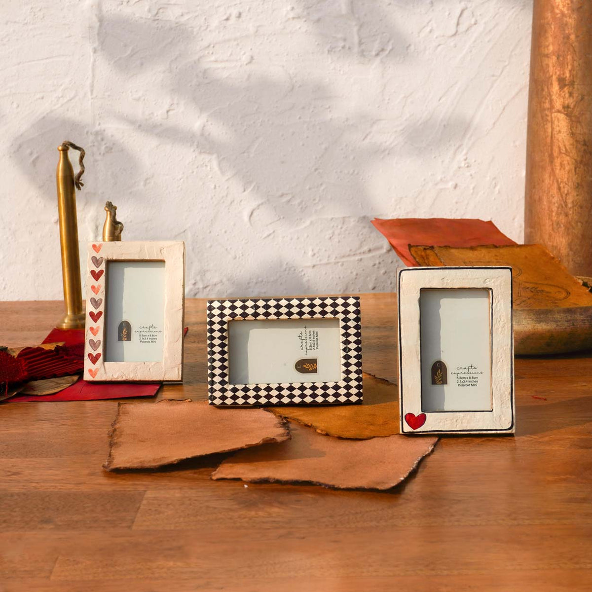 Three Vintage Hearts wooden Instax Mini frames styled with dried leaves and ribbon