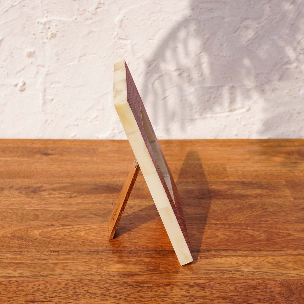 Side view of the Dottie square photo frame with easel stand