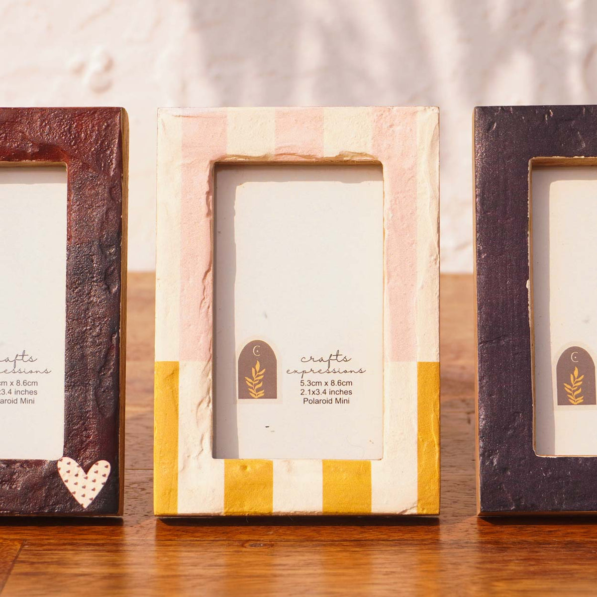 Close-up of First Crush frames in burgundy, blush and orange