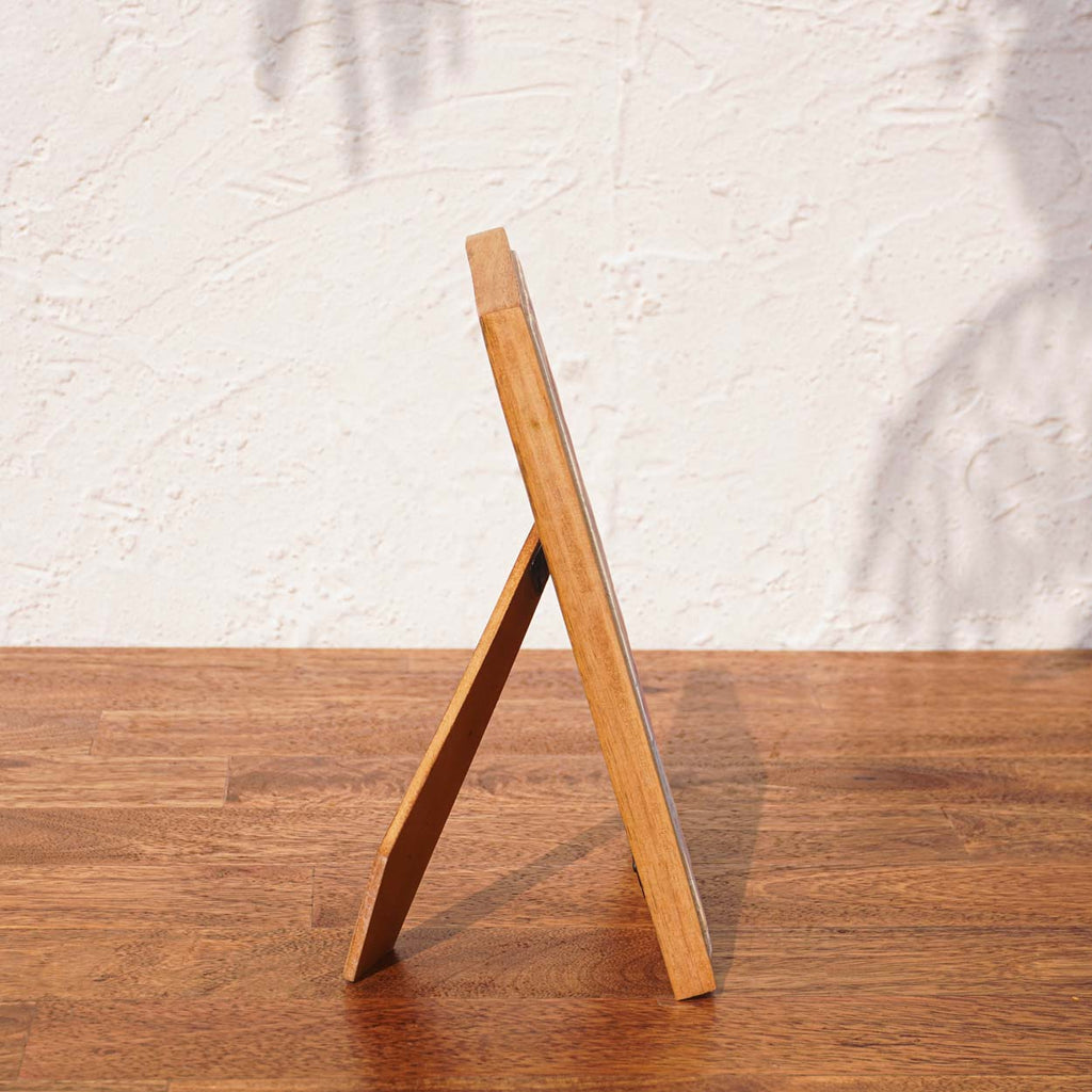 Side view of the Little Hearts wooden photo frame with easel stand
