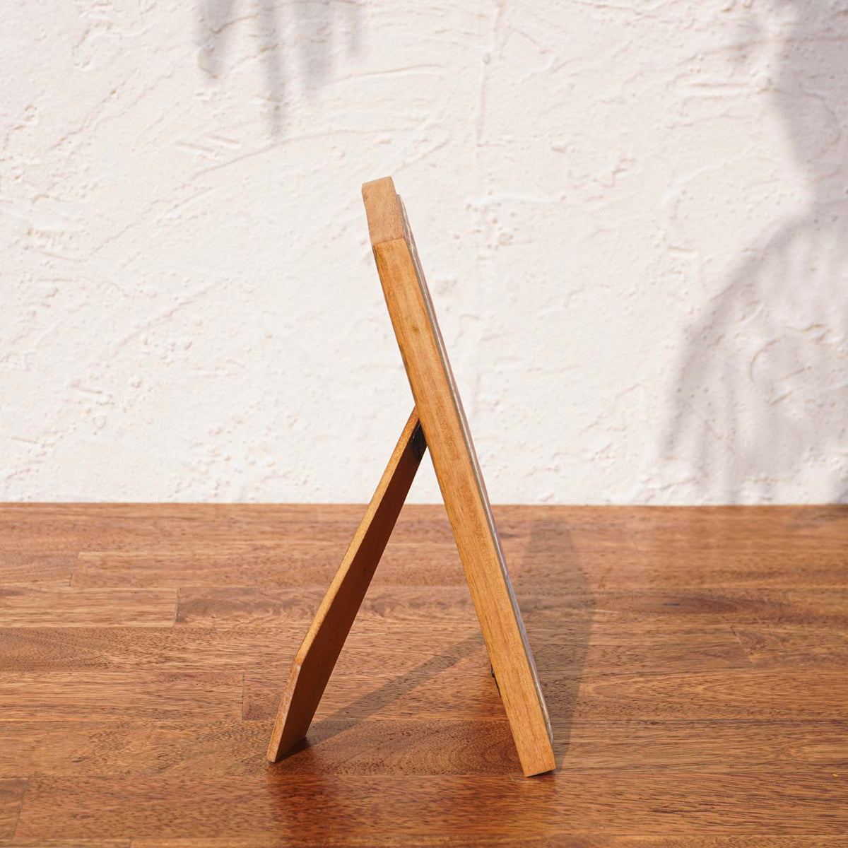 Side view of the Little Hearts wooden photo frame with easel stand