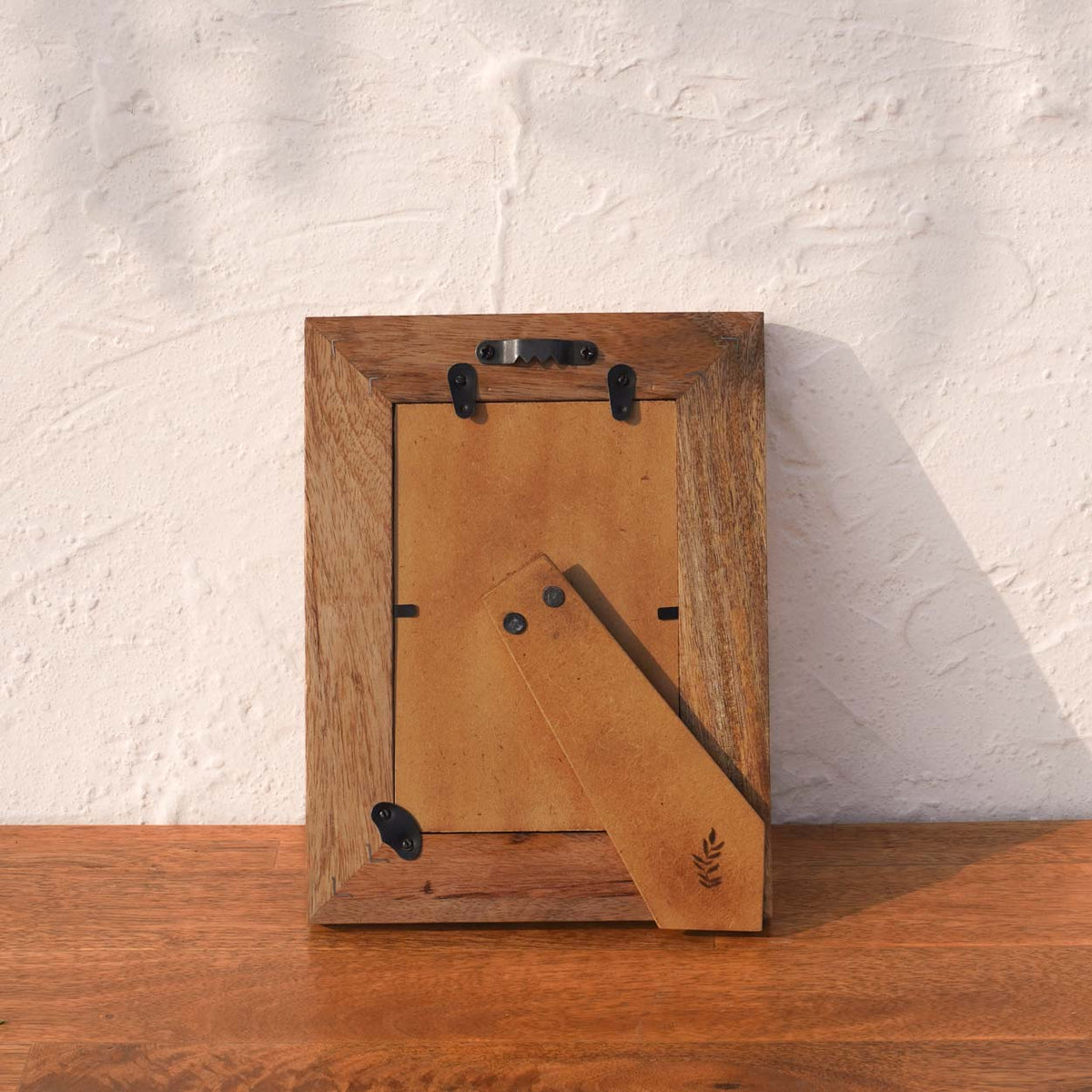 Back view of the Baby Blue wooden photo frame with easel stand and wall fittings