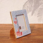 Angled view of the Baby Blue wooden photo frame displayed vertically
