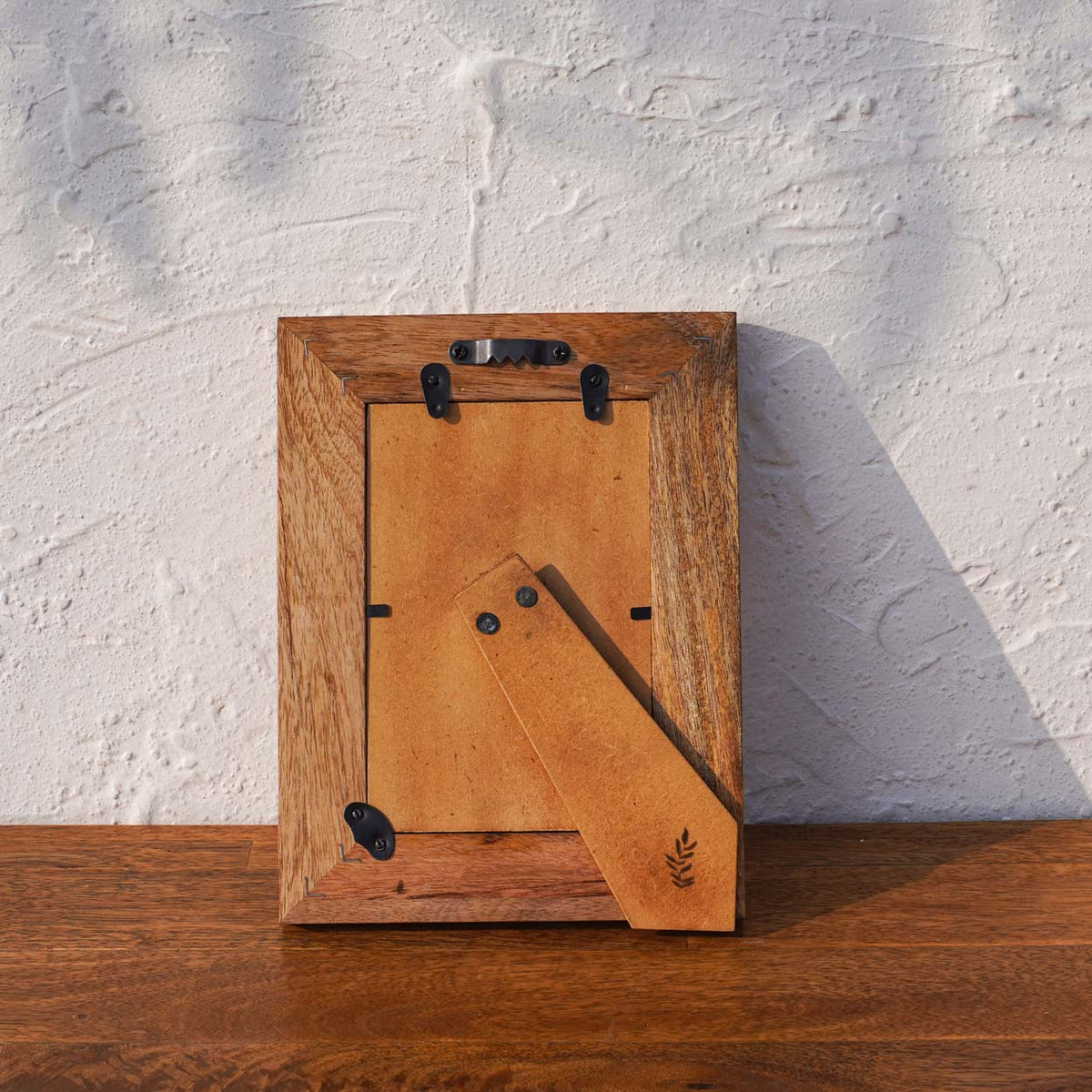 Back view of the Morning Love wooden photo frame with easel stand and wall fittings