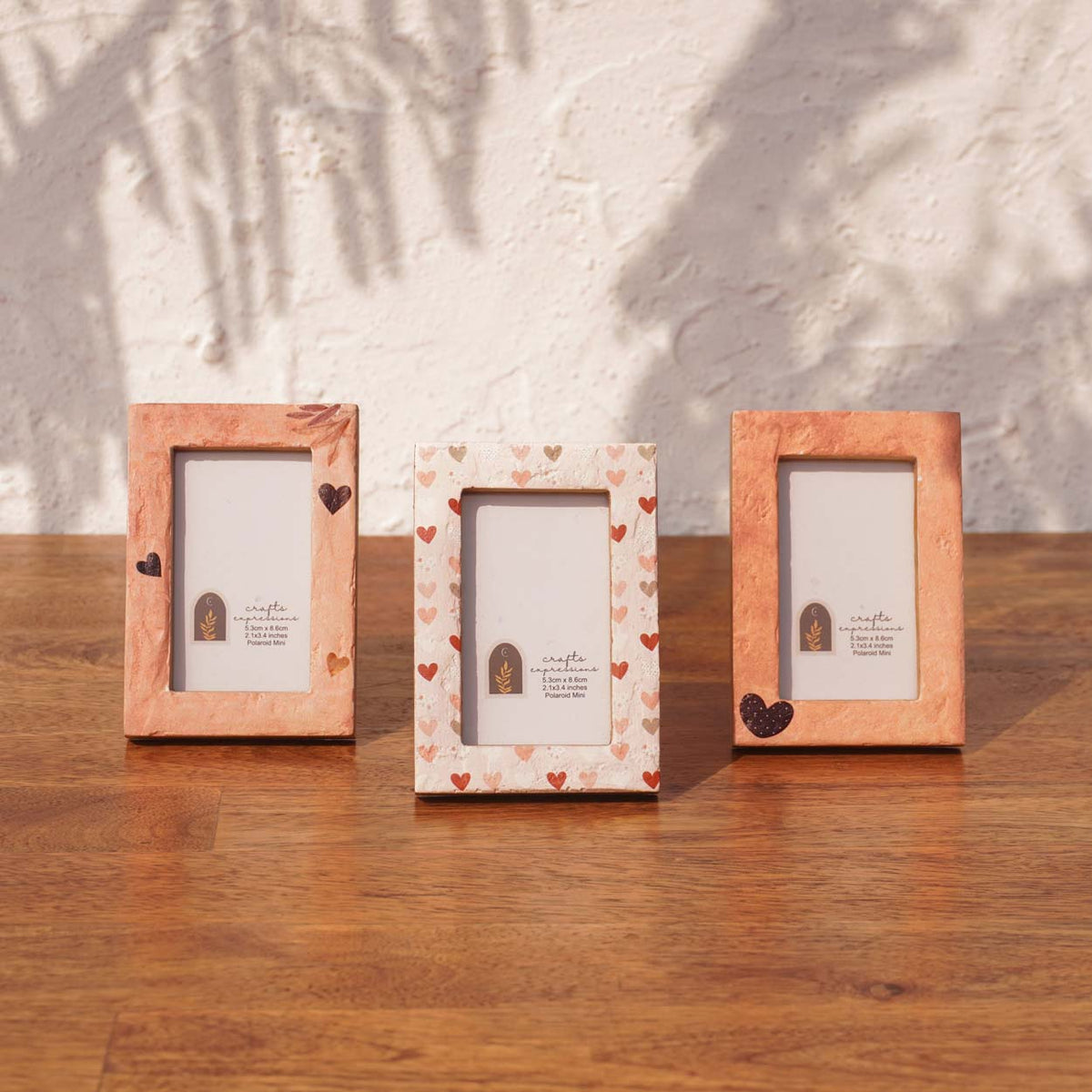 Set of three Beloved wooden Instax Mini frames in peach, white and heart patterns