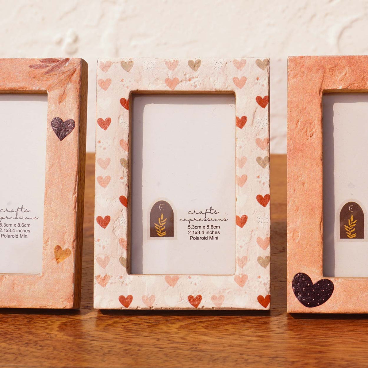Close-up of Beloved wooden Instax Mini frames with painted heart details