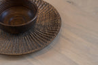 Close-up of a cup on the Siesta hamper wooden platter