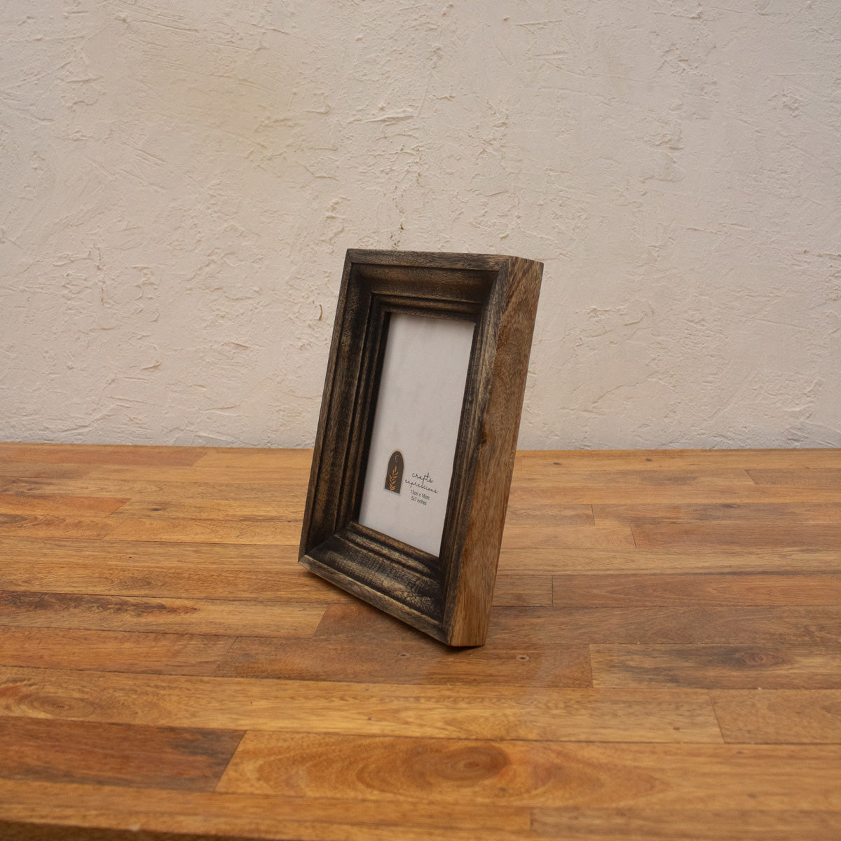 Side view of the dark wooden photo frame with easel stand