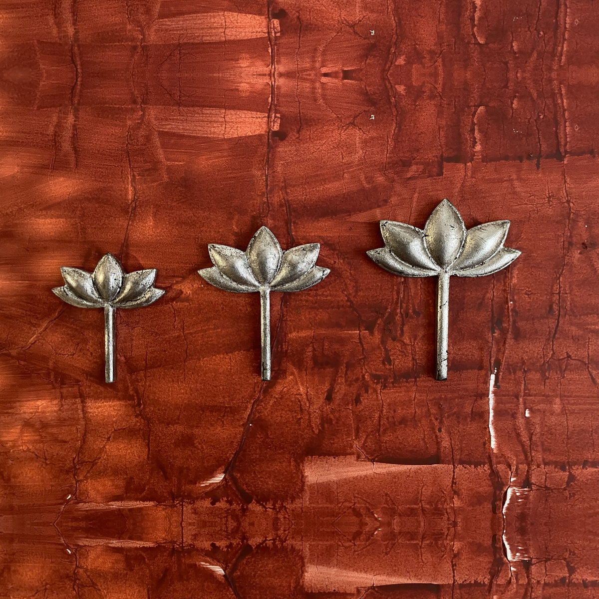 Three Kamal lotus-shaped wooden wall decorations displayed together