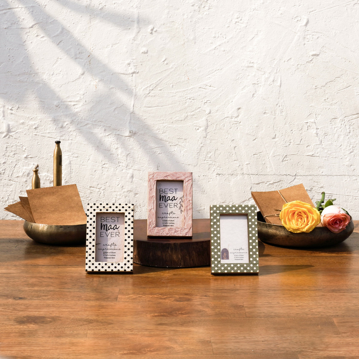 Dots & Petals wooden Instax Mini frames styled with flowers and brass décor