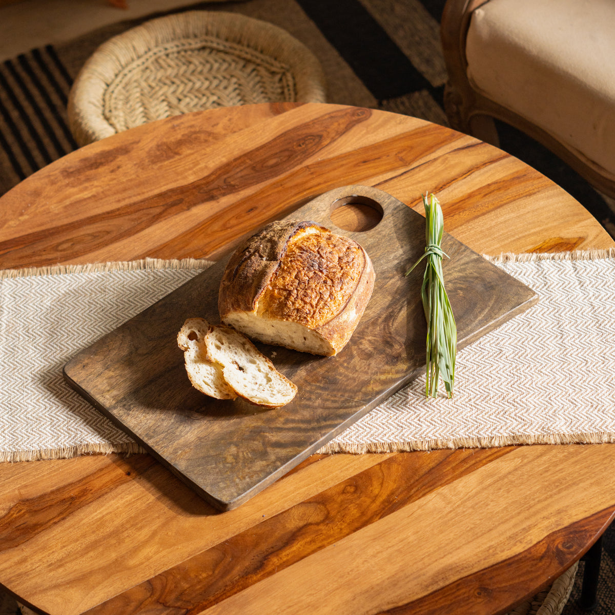 Drift charcuterie board styled with bread and herbs