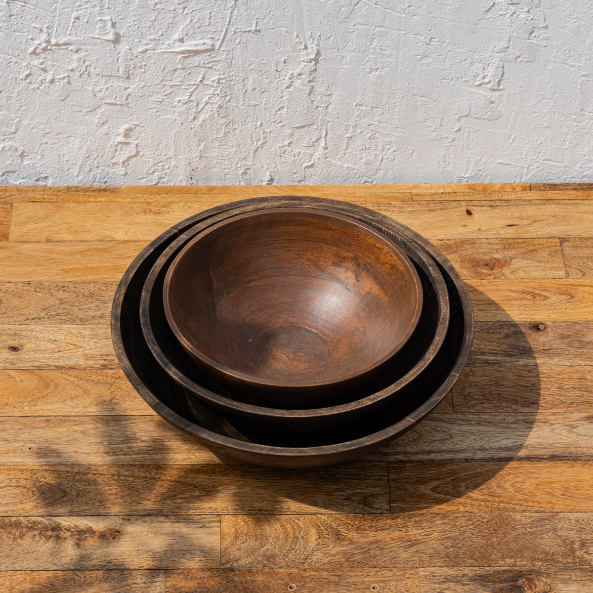Three Ellipse wooden bowls nested together