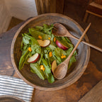 Top view of salad in the Ellipse large wooden serving bowl with wooden servers