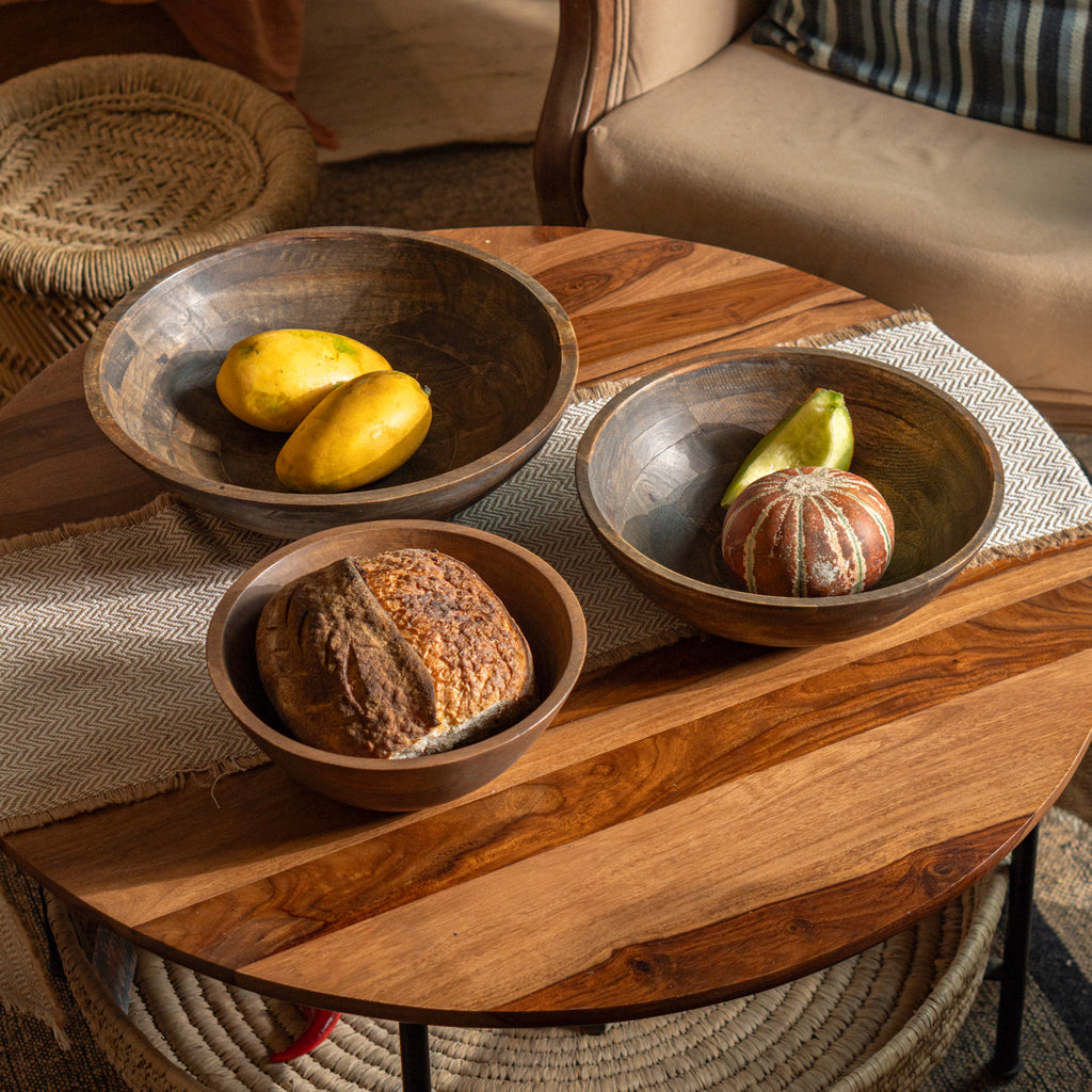 Ellipse wooden bowl set styled with food on a dining table
