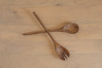 Pair of Ellipse wooden salad servers crossed on a tabletop