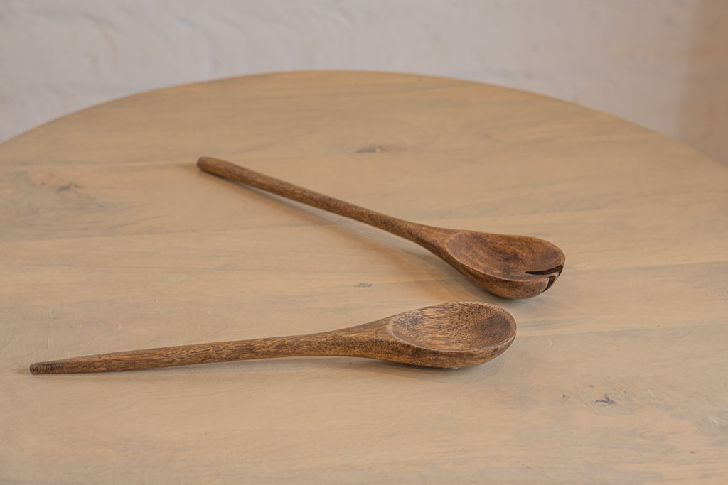 Pair of Ellipse wooden salad servers on a tabletop