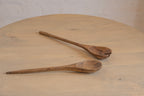 Pair of Ellipse wooden salad servers on a tabletop