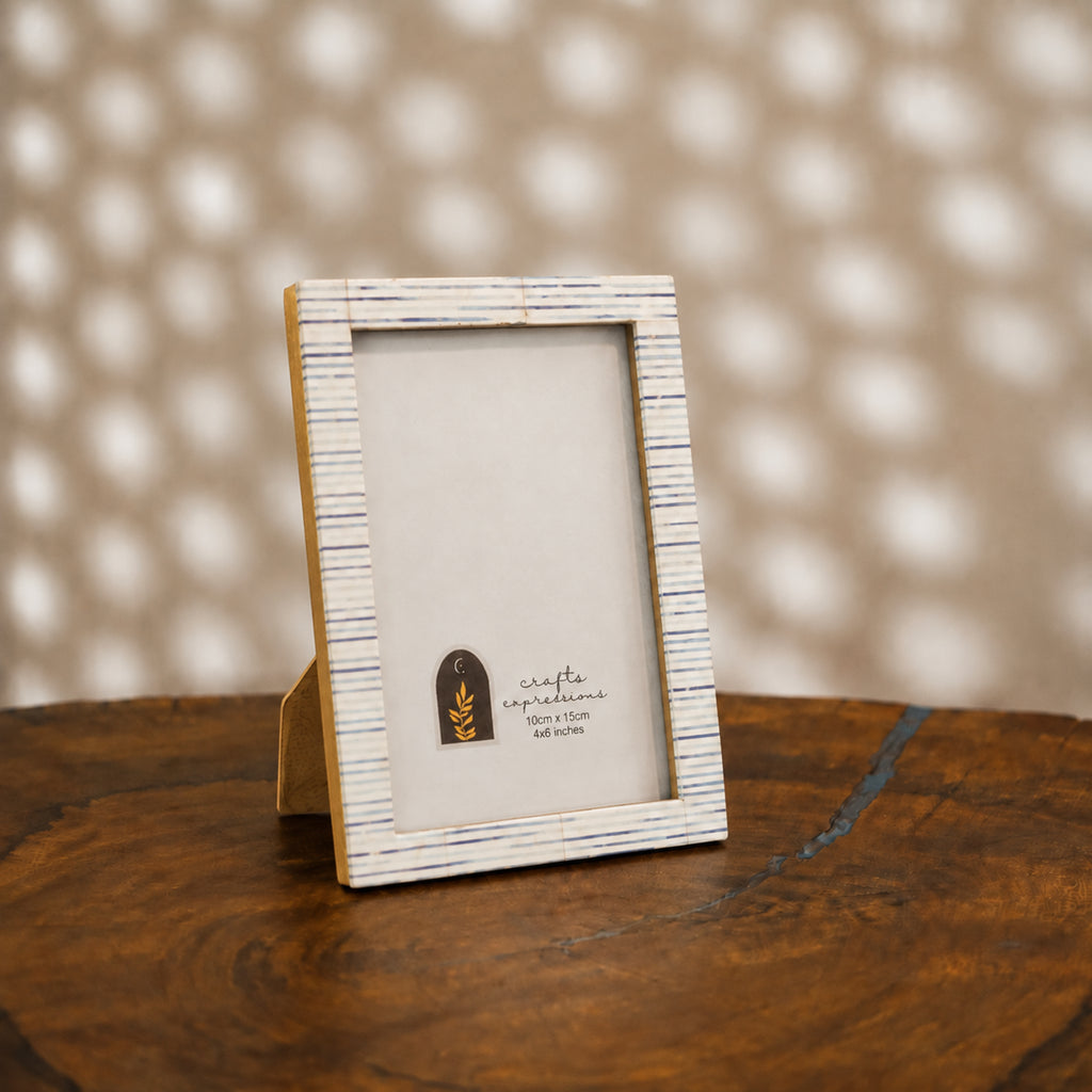 Warm-white wooden photo frame with fine blue-grey stripes for a 4 by 6 inch photograph