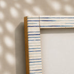 Warm-white wooden photo frame with fine blue-grey stripes for a 4 by 6 inch photograph
