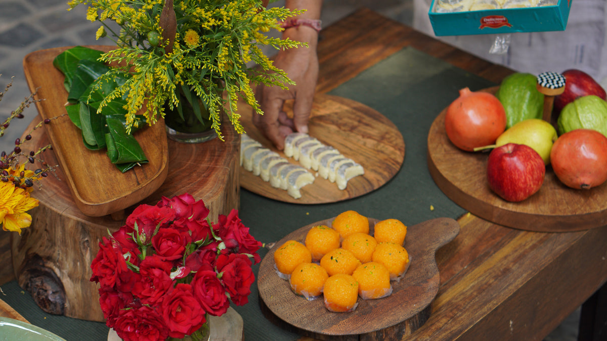 Plateau wooden board set styled with fruit and flowers