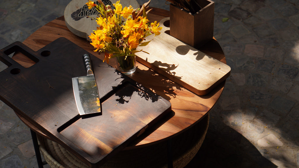 Oversized wooden butcher board styled with food