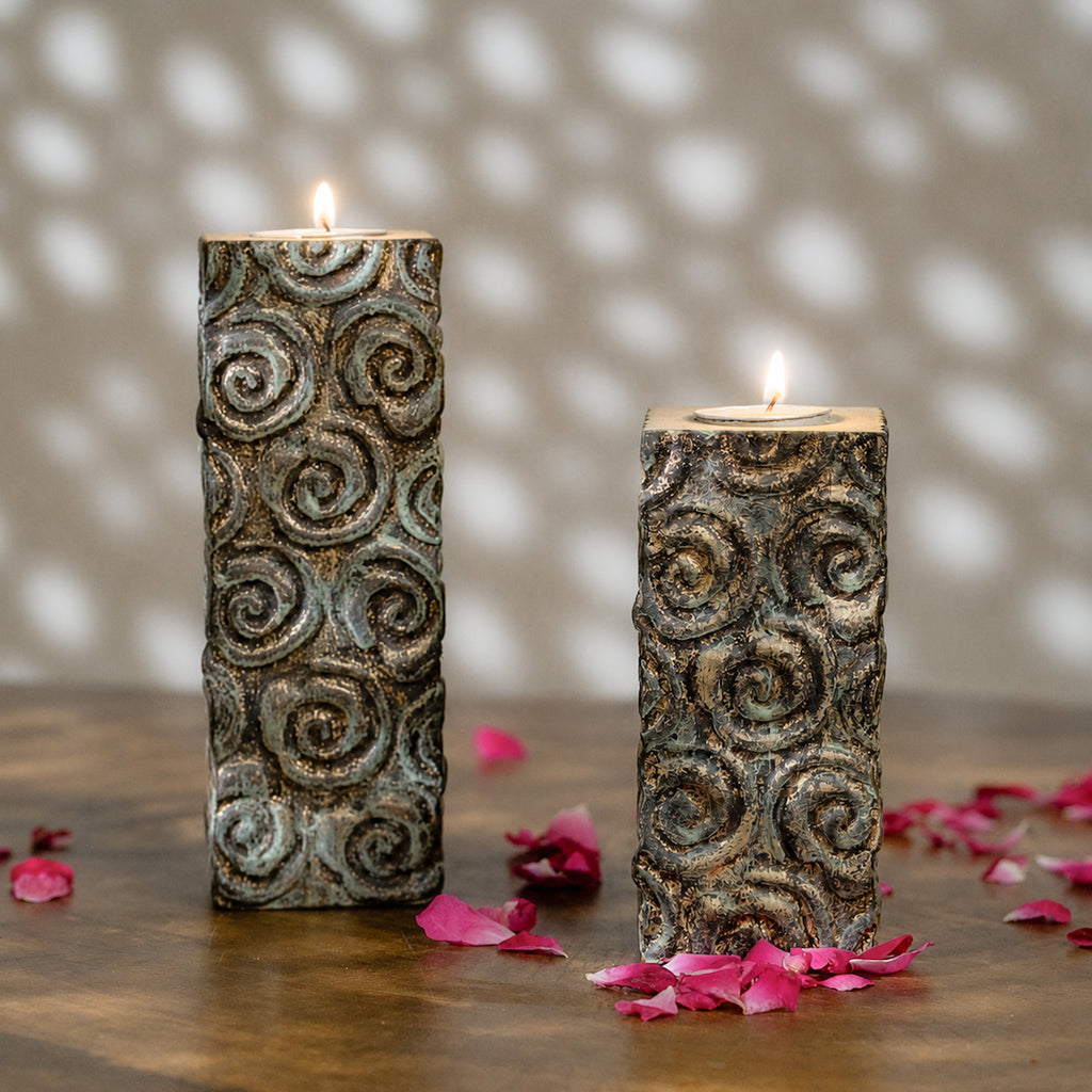 Set of two tall antique carved wooden tea light holders in different heights