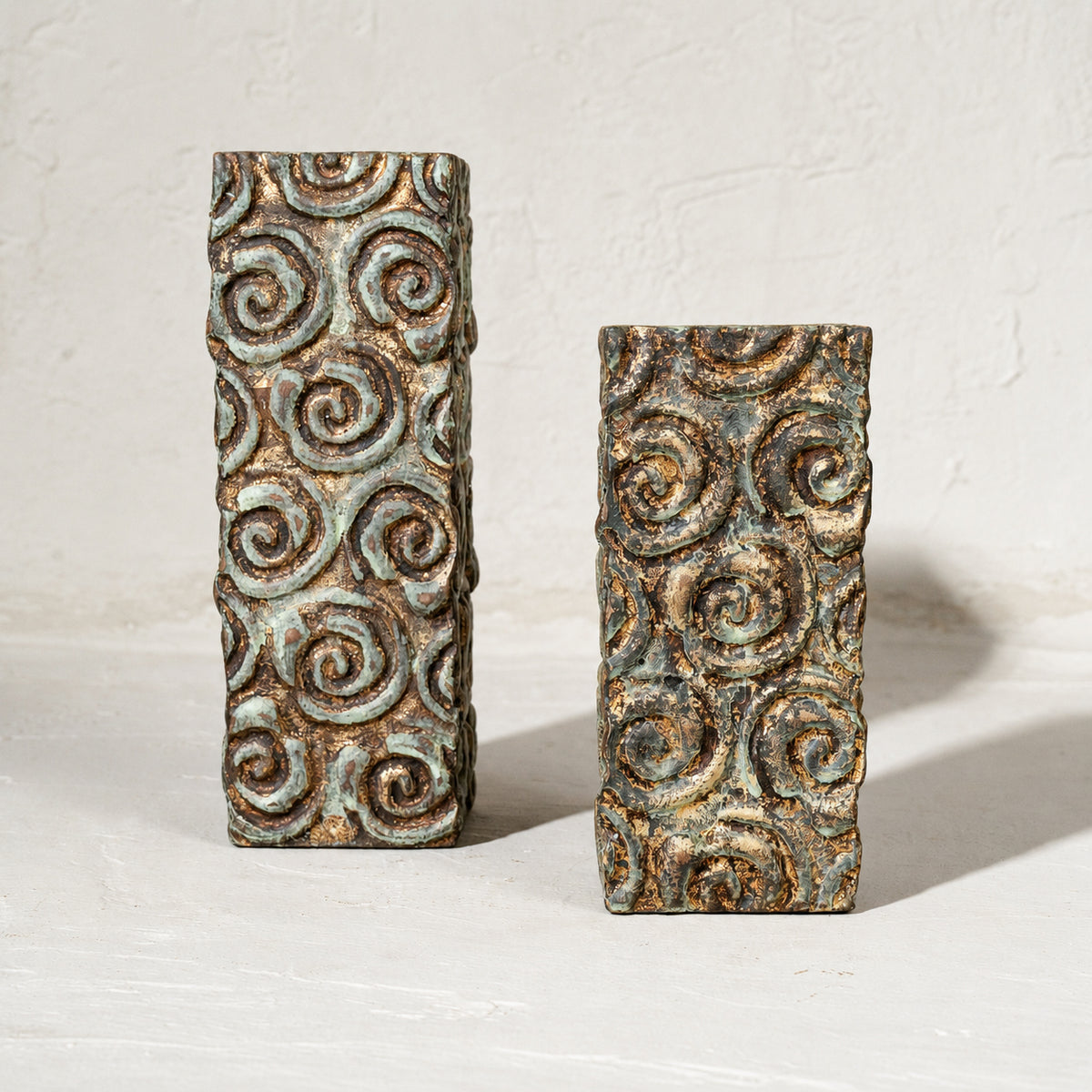 Set of two tall antique carved wooden tea light holders in different heights
