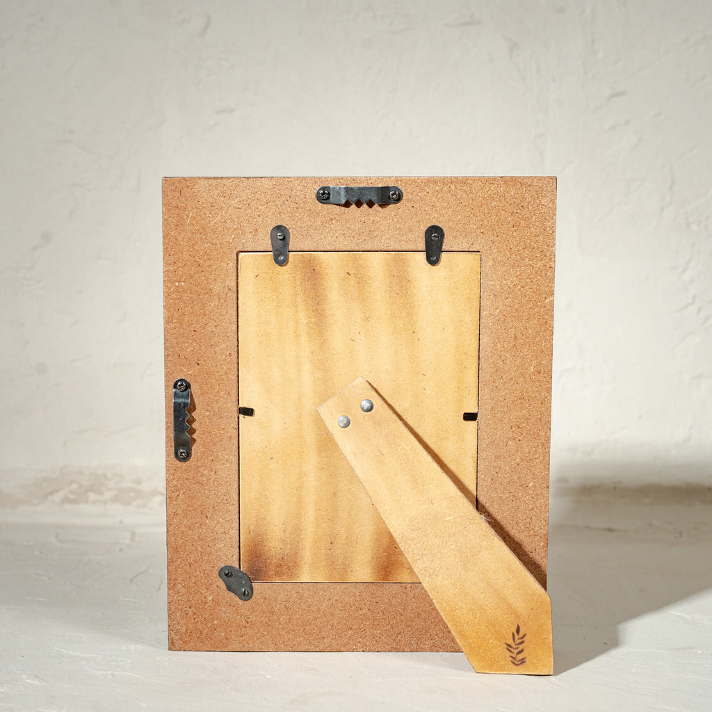 Back view of the Jugnu wooden photo frame with easel stand and wall fittings