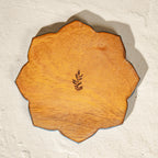Set of six scalloped wooden coasters with blue embroidery-inspired patterns