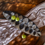 Black and white leaf-shaped wooden serving platter for snacks and mithai