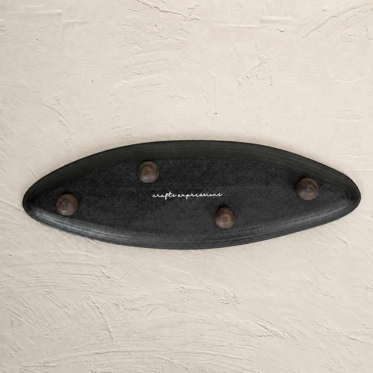 Black and white leaf-shaped wooden serving platter for snacks and mithai