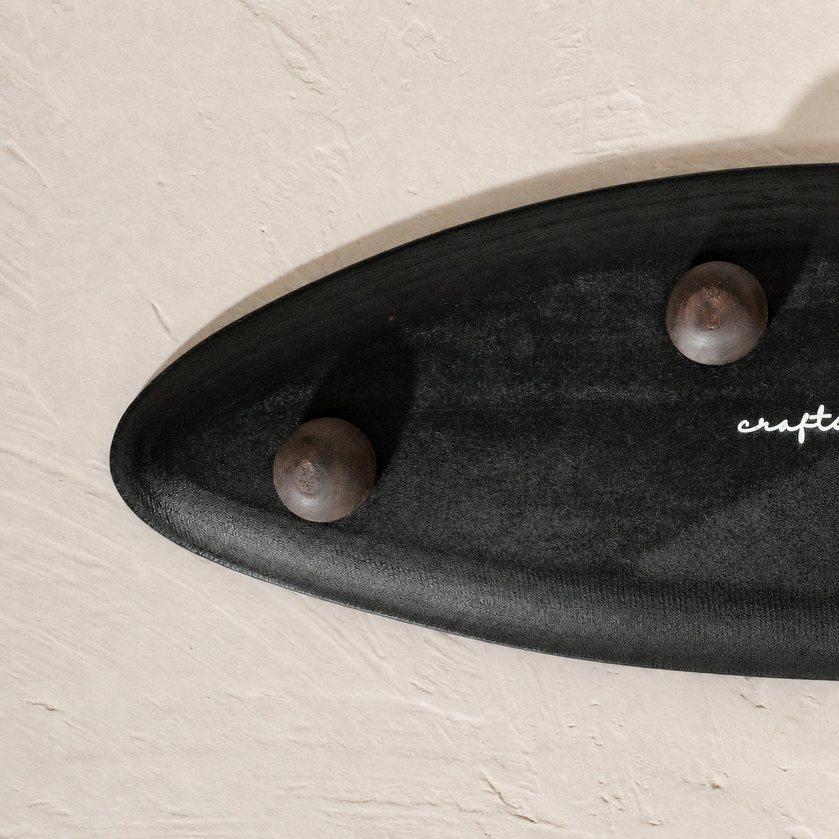 Black and white leaf-shaped wooden serving platter for snacks and mithai