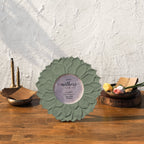Olive green Lotus round photo frame styled with flowers and brass décor